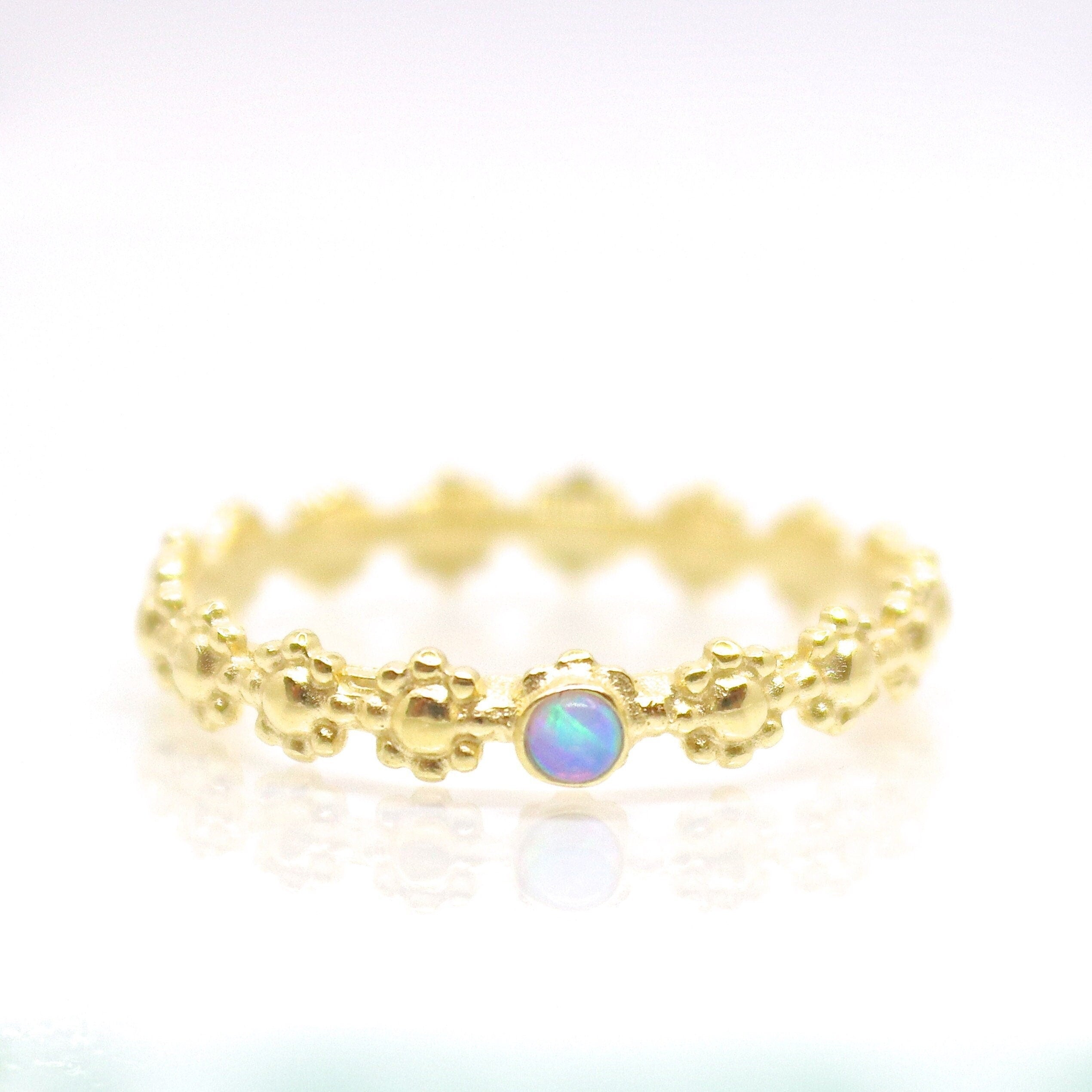 טבעת אופל מזהב 14 קראט משובצת פרחים