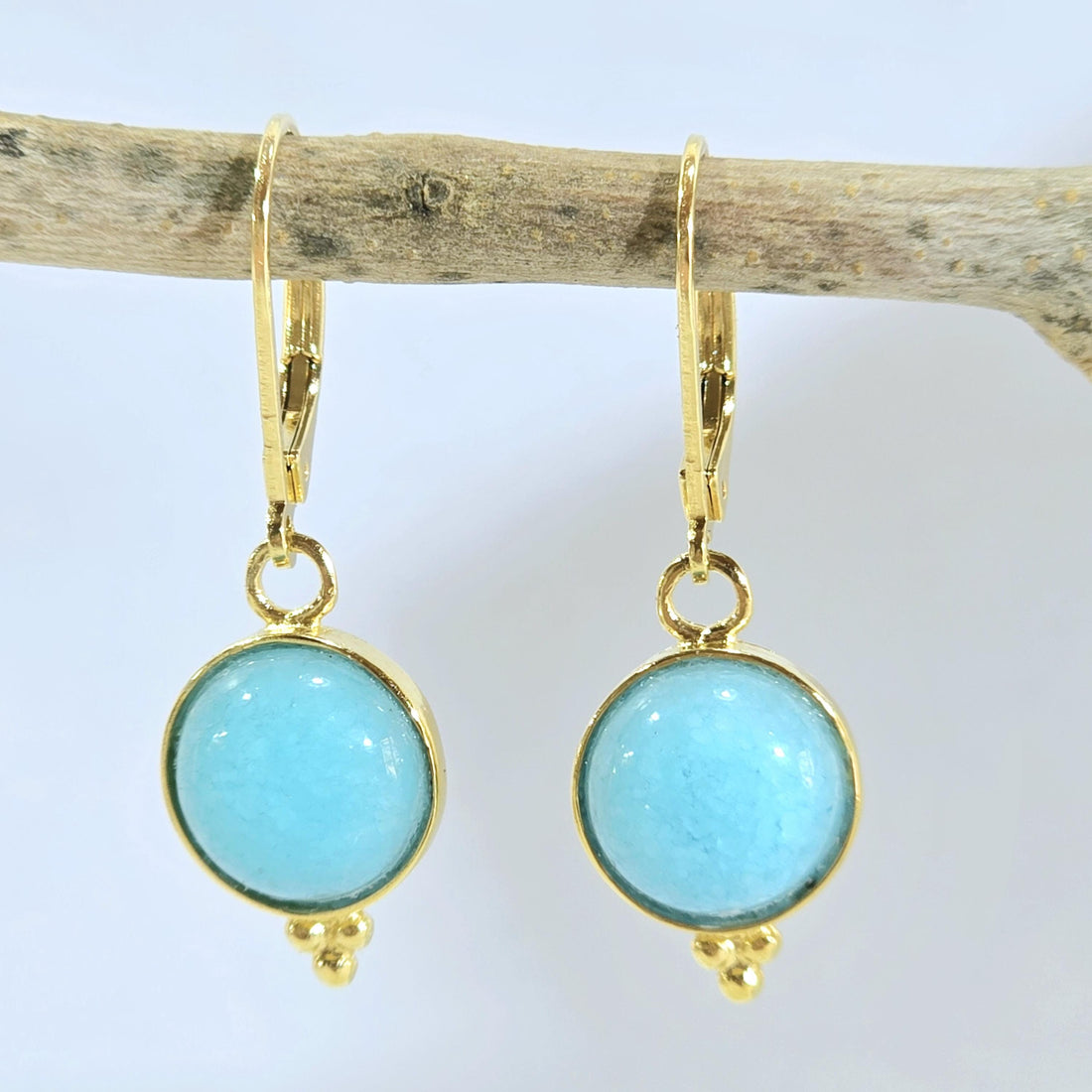 עגילי זהב עגולים עם אקוומרין