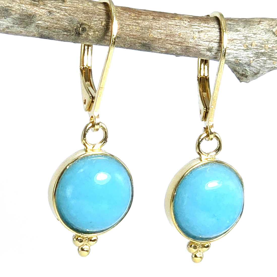 עגילי זהב עגולים עם אקוומרין