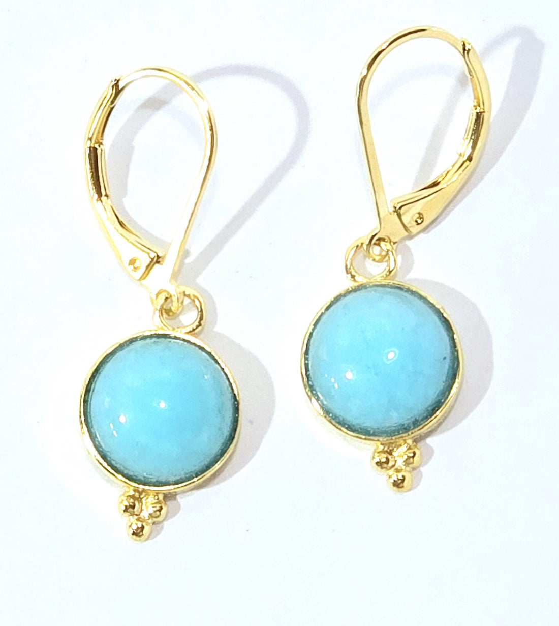 עגילי זהב עגולים עם אקוומרין